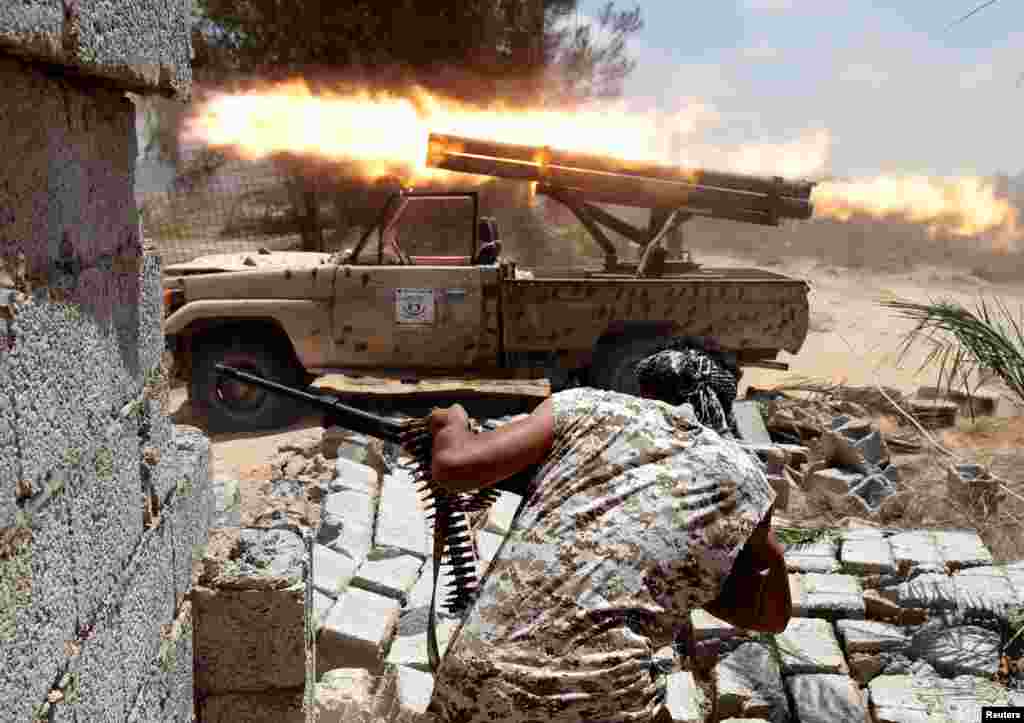 Libyan forces allied with the U.N.-backed government fire weapons during a battle with Islamic State fighters in Sirte, Libya.