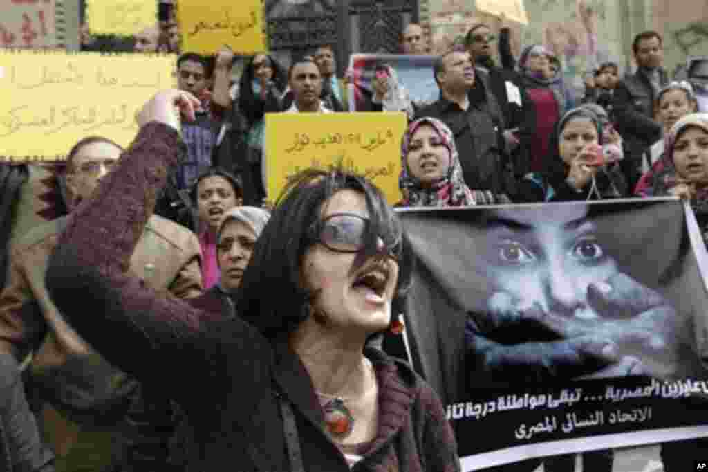 An Egyptian activist shouts anti-military Supreme Council slogans during a demonstration in front of Cairo's high court, Egypt, Friday, March 16, 2012 as they protest against a military tribunal verdict acquitting an army doctor of an accusation of publi