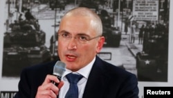 FILE - Freed Russian former oil tycoon Mikhail Khodorkovsky speaks during a news conference at the Museum Haus in Berlin, Dec. 22, 2013.