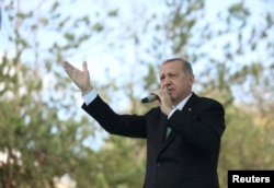 Turkish President Recep Tayyip Erdogan addresses his supporters in Bayburt, Turkey, Aug. 10, 2018.