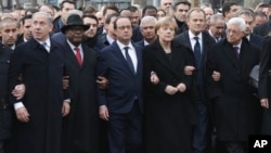 L-R: Israel's Benjamin Netanyahu, Mali's Ibrahim Boubacar Keita, France's Francois Hollande, Germany's Angela Merkel, the EU's Donald Tusk, and Palestinian President Mahmoud Abbas march during a unity rally in Paris, Jan. 11, 2015.