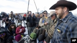 Ammon Bundy, a leader of the occupying protesters at the Malheur National Wildlife Refuge, speaks to reporters during a news conference at the refuge near Burns, Ore., Jan. 6, 2016. (AP Photo/Rick Bowmer)