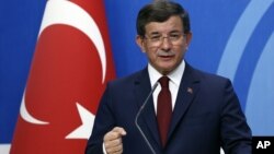 Turkish Prime Minister Ahmet Davutoglu speaks to the media at the headquarters of his ruling Justice and Development Party, AKP, in Ankara, Turkey, May 5, 2016. He has said someone else should lead the AKP.