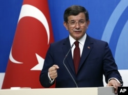 Turkish Prime Minister Ahmet Davutoglu speaks to the media at the headquarters of his ruling Justice and Development Party, AKP, in Ankara, Turkey, May 5, 2016.