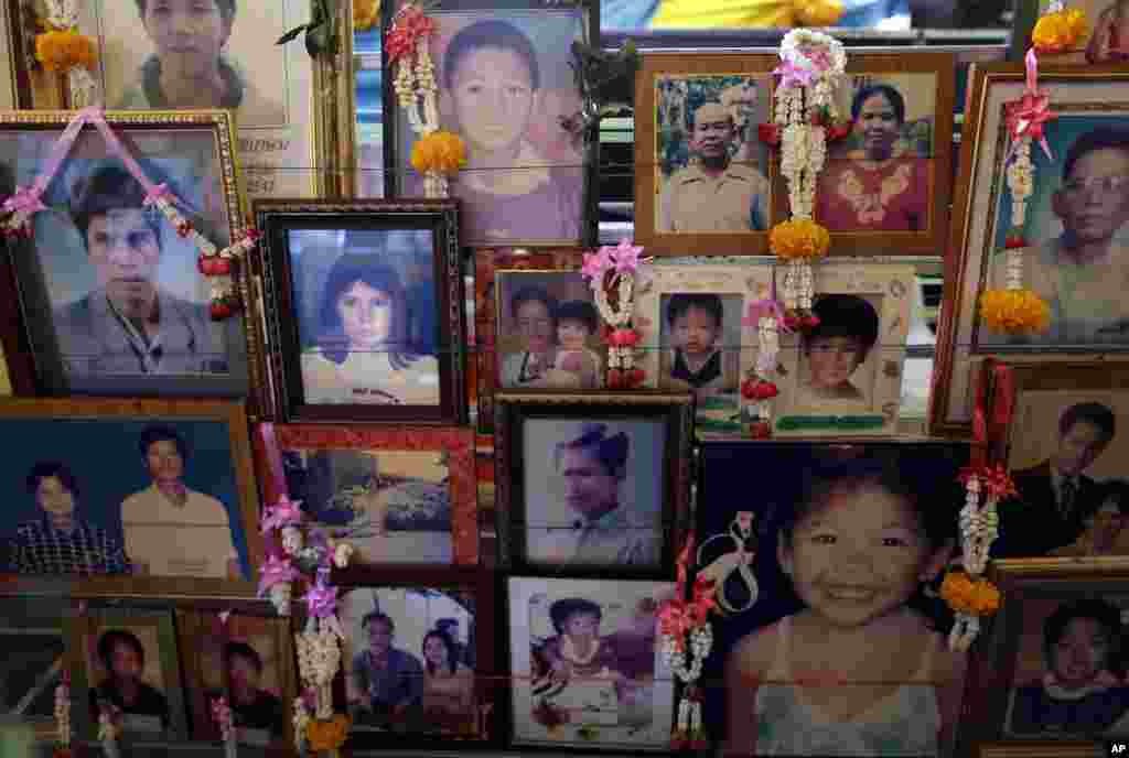 Portraits of victims from the Asian tsunami are displayed during a memorial service, Friday, Dec. 26, 2014 in Phang Nga, Ban Nam Khem province, Thailand.