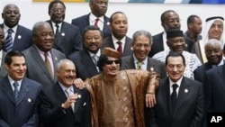 Libyan leader Moammar Gadhafi, centre, with Egyptian President Hosni Mubarak, right, and his Yemeni counterpart Ali Abdullah Saleh, centre left, during a group picture with Arab and African leaders during the second Afro-Arab summit in Sirte, Libya, 10 Oc