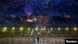 Confetti rains down at the end of the closing ceremony for the 2014 Sochi Winter Olympics, Feb. 23, 2014.