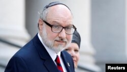 Jonathan Pollard, a former U.S. Navy intelligence officer convicted of spying for Israel, exits following a hearing at the Manhattan Federal Courthouse in New York, May 17, 2017.