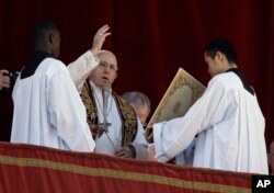 Pope Francis delivers the Urbi et Orbi blessing from the main balcony of St. Peter's Basilica at the Vatican, Dec. 25, 2018.