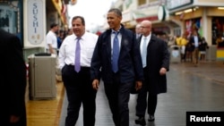U.S. President Barack Obama and New Jersey Governor Chris Christie, left, on the boardwalk, Point Pleasant, May 28, 2013.