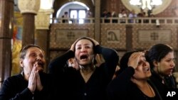 Women cry during the funeral for those killed in a Palm Sunday church attack in Alexandria Egypt, at the Mar Amina church, April 10, 2017. (AP Photo/Samer Abdallah)