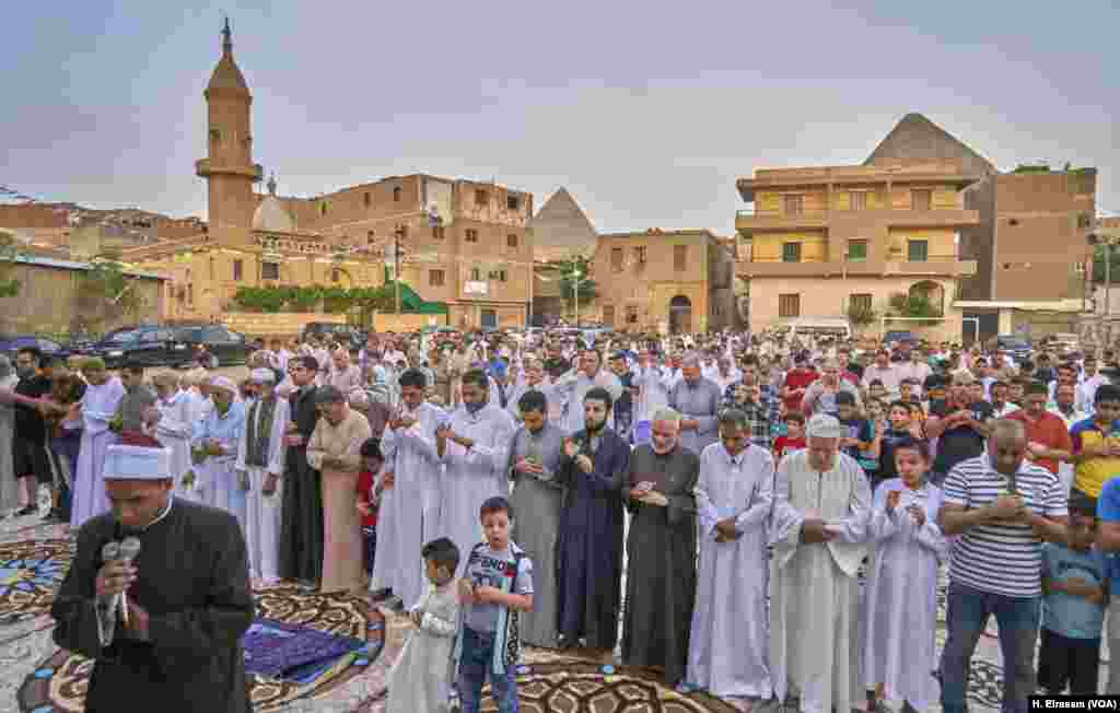 Men gather in Giza, just outside Cairo, for Eid prayers Wednesday.