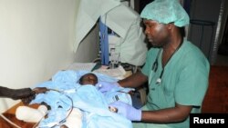 A boy who was injured in an attack by rebel gunmen on vehicles on the road connecting Yei town to the capital, Juba, receives treatment at a military hospital in Juba, South Sudan, Oct. 18, 2016.