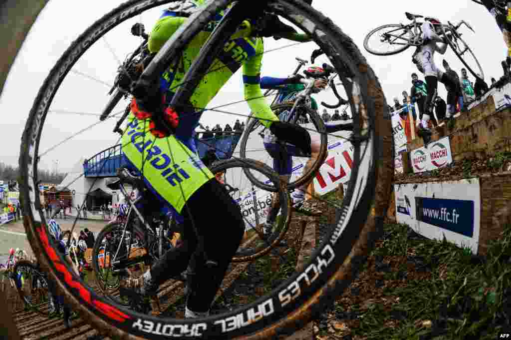 Cyclists compete during the French cyclo-cross championships in Nommay.&nbsp;