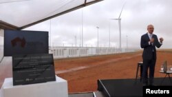 South Australian Premier Jay Weatherill speaks as he stands next to a plaque during the official launch of the Hornsdale Power Reserve, featuring the world's largest lithium ion battery made by Tesla, near the South Australian town of Jamestown, Dec. 1, 2