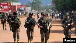 FILE - French soldiers are seen patrolling a street in Bangui.