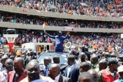 Kenya's opposition leader Raila Odinga waves as he arrives for the Azimio la Umoja (Declaration of Unity) rally to unveil his August 2022 Presidential race candidature at the Moi International Sports centee in Kasarani, Nairobi, Dec. 10, 2021.