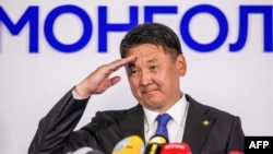 FILE - Mongolia's President Ukhnaagiin Khurelsukh salutes after delivering a speech in Ulaanbaatar, June 9, 2021. 