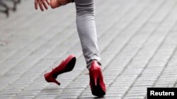 A participant takes part in a high heel race to protest in favor of gender equality in Monterrey, Mexico May 12, 2019. 