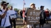 FILE - Demonstrators shout during a "Freedom of Speech Rally Round II" outside the Islamic Community Center in Phoenix, Arizona May 29, 2015.