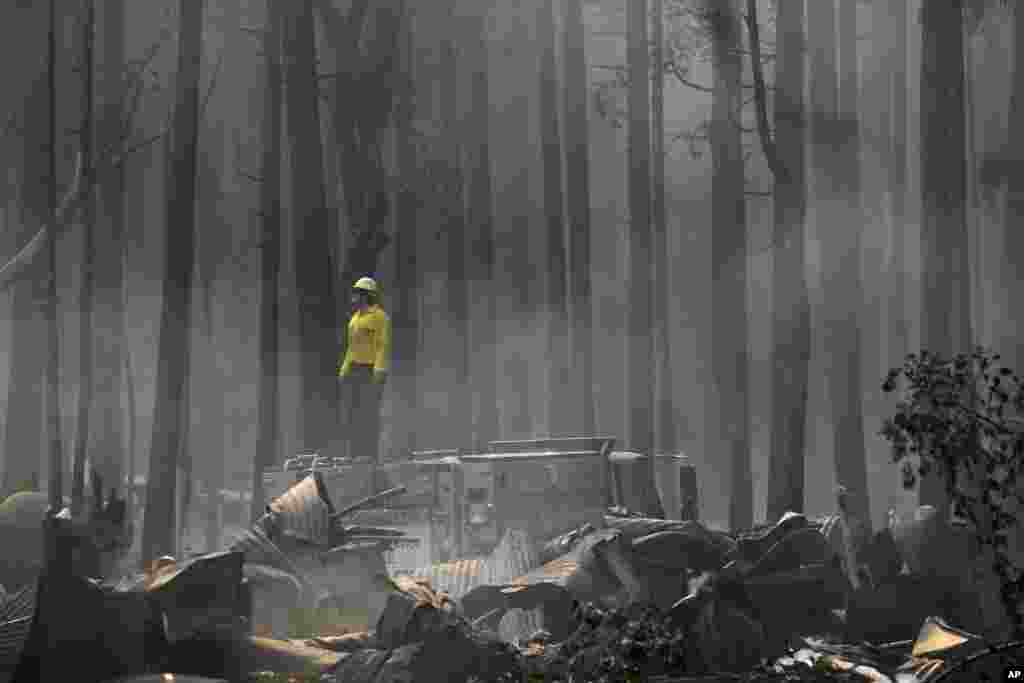 A firefighter stands on top of a fire truck at a campground destroyed by the Rim Fire near Yosemite National Park, California, August 26, 2013.