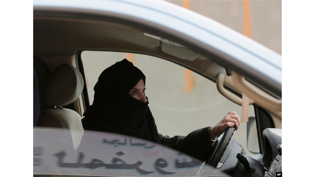 FILE - Aziza Yousef drives a car on a highway in Riyadh, Saudi Arabia, as part of a campaign to defy Saudi Arabia's ban on women driving, March 29, 2014.