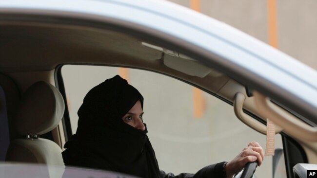 In this file photo, Aziza Yousef drives a car on a highway in Riyadh, Saudi Arabia, as part of a campaign to defy the country's ban on women driving.