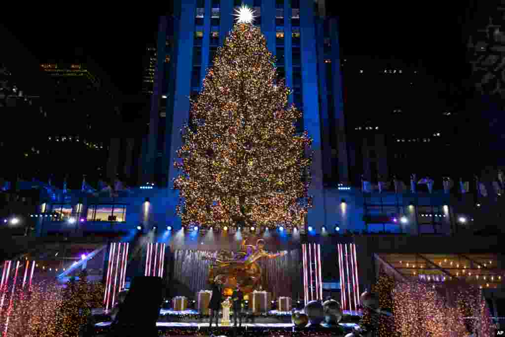 More than 50,000 lights on the 75-foot-tall Christmas Tree are illuminated at the annual Rockefeller Center Christmas Tree lighting ceremony, Dec. 2, 2020, in New York.
