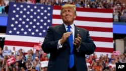 FILE - President Donald Trump arrives to speak at a campaign rally at the Landers Center Arena, Oct. 2, 2018, in Southaven, Miss.