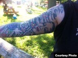Melissa Thomas, IT specialist in Washington, D.C. and her Japanese theater mask tattoo.