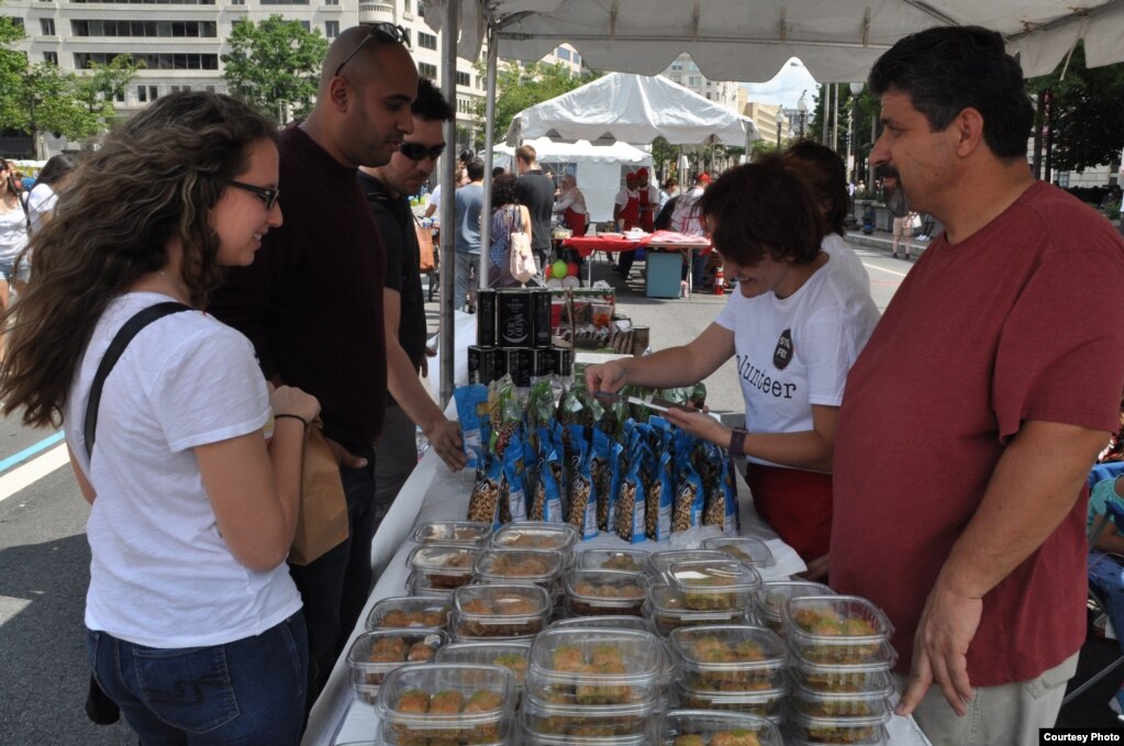 One vendor at Syria Fest, a Turkish grocery store called Amity Market, offers a variety of sweets and savory dishes from Turkey and Syria, in Washington, Sept. 3, 2017. (Photo courtesy of Rabah Seba)