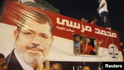 A picture of Egypt's President Mohamed Morsi on a vehicle in Tahrir Square, Cairo, July 10, 2012.