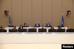 FILE - Presiding Judge Robert Fremr is pictured in the courtroom during the trial of Congolese warlord Bosco Ntaganda at the ICC (International Criminal Court) in the Hague, the Netherlands, Aug. 28, 2018.