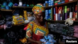 hade Ajayi, 50, shops for thread for her bag-making business, at a store in Ilorin, Kwara state, March, 26, 2021. REUTERS/Temilade Adelaja