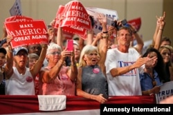 Supporters cheer as Republican presidential candidate Donald Trump arrives to speak at a campaign rally in Fredericksburg, Va., Aug. 20, 2016.