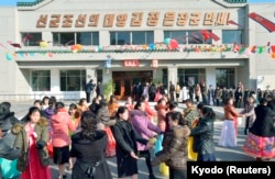 FILE - People dance to celebrate as the nation holds elections for deputies to the 13th Supreme People's Assembly (SPA) in Pyongyang, March 9, 2014. North Korea holds nation-wide elections to pick deputies to the Supreme People's Assembly for a new five-year term.