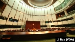 Hong Kong's legislature rejected the Beijng-supported plan for electing the city's chief executive.