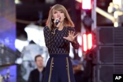 Taylor Swift performs on ABC's "Good Morning America" in Times Square, Oct. 30, 2014, in New York.