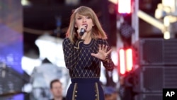 Taylor Swift performs on ABC's "Good Morning America" in Times Square, Oct. 30, 2014, in New York.