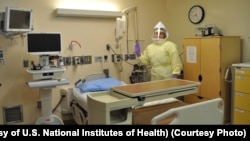Workers must wear protective gear to care for patients with Ebola or other infectious disease in the NIH Clinical Center's high containment unit. (Photo courtesy of the U.S. National Institutes of Health)