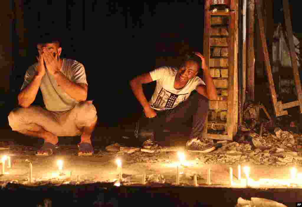 People light candles at the scene of the Karrada attack in Baghdad.