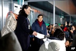 Kim Yo Jong (L) sister of North Korean leader Kim Jong Un, shakes hands with South Korean President Moon Jae-in at the opening ceremony of the 2018 Winter Olympics in Pyeongchang, South Korea, Feb. 9, 2018.