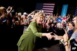 Democratic presidential candidate Hillary Clinton arrives to speak at a rally in Entertainment Hall at the Florida State Fairgrounds in Tampa, July 22, 2016.