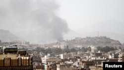 Smoke rises after an airstrike in Sanaa, Yemen, March 22, 2018.