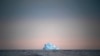 A large iceberg floats away near Kulusuk, Greenland, on Aug. 15, 2019. (AP Photo/Felipe Dana)