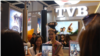 TV actress Nancy Wu poses for a photo with a fan at FILMART in Hong Kong, March 14, 2017. (Nov Povleakhena/VOA Khmer)