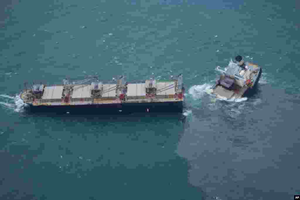 This photo provided by the Japan Coast Guard shows a vessel that has broken apart and leaked oil off Hachinohe, northeastern Japan.&nbsp;The Panamanian-registered cargo ship, Crimson Polaris, ran aground and later broke in two parts and was spilling oil into the sea, Japanese Coast Guard said.