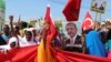 FILE - Somali people carry Turkish and Somali flags as they gather in support of Turkish President Recep Tayyip Erdogan and his government in Somalia's capital Mogadishu, July 16, 2016. 