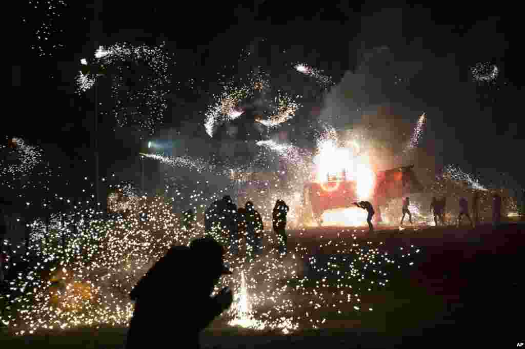 Fireworks explode from a wheeled paper bull rigged with pyrotechnics during the annual pyrotechnics fair in Tultepec, on the outskirts of Mexico City, March 8, 2017.