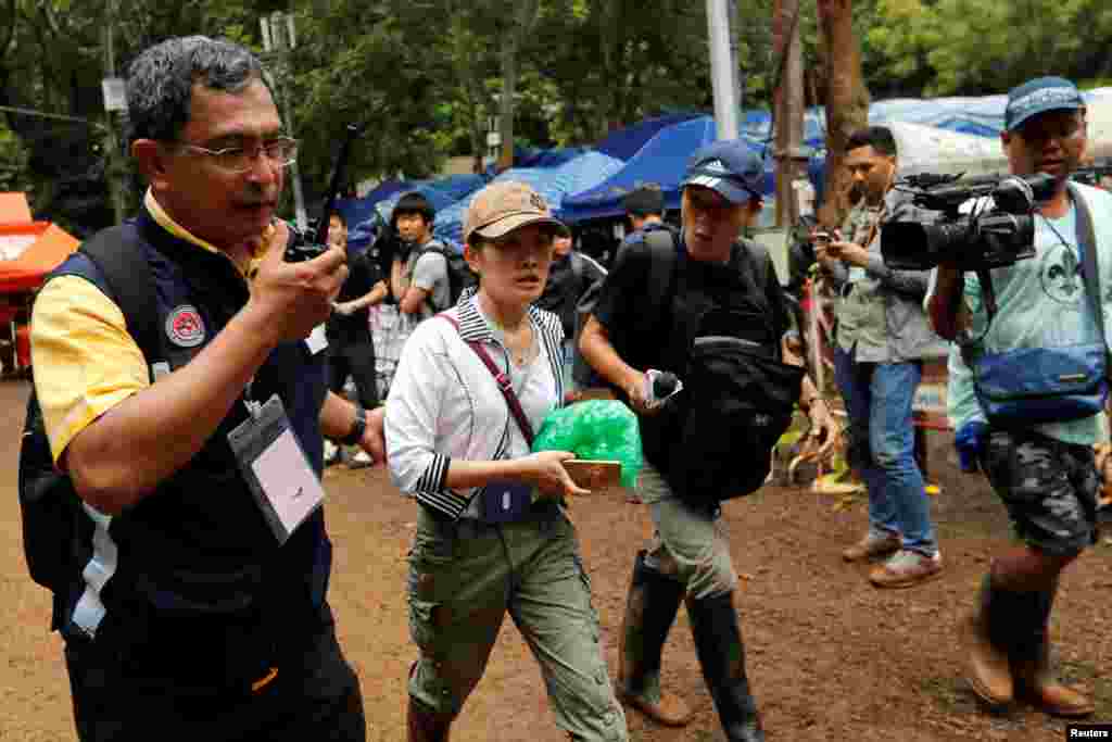 A family member walks outside the Tham Luang cave complex, July 8, 2018.